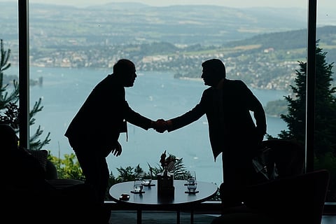 Delegation staff members meet in the lobby on the first day of a quadrilateral meeting between the US, Iran, Pakistan, and Qatar at the Buergenstock Resort Lake Lucerne, near Stansstad, Switzerland, Sunday, June 21, 2026.