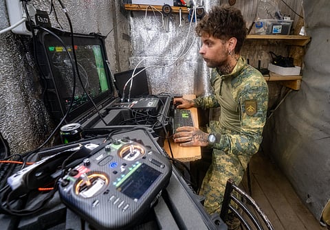 A Ukrainian serviceman of Khartia brigade controls an interceptor drone in the command centre Kharkiv region, Ukraine, 26 June 2026.