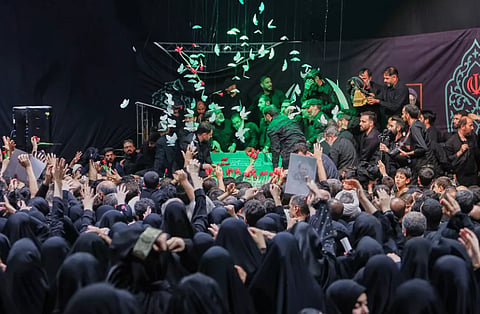 In this photo released by Iran's Supreme Leader's office, mourners gather around the coffin of Iran's Supreme Leader Ayatollah Ali Khamenei as it lies in a mourning hall adjacent to the Imam Khomeini Hussainiya within the Supreme Leader's compound before his funeral in Tehran, Iran, late Thursday, July 2, 2026.