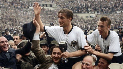 West Germany captain Fritz Walter on the shoulders of fans with the Jules Rimet trophy in hand after the 1954 World Cup final against Hungary in Bern, Switzerland.