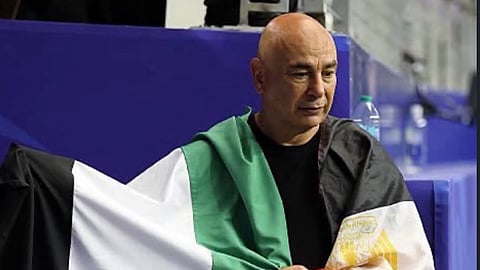 Egypt coach Hossam Hassan adorning the Palestine and Egypt flag