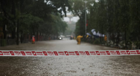 A waterlogged road is temporarily closed after heavy rains in Mumbai, India, 4 July 2026.