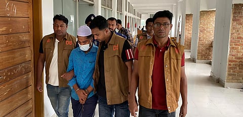 Convict Shahadat is taken into custody after a Noakhali court sentenced him to death on Monday for the rape and murder of a five-year-old girl.
