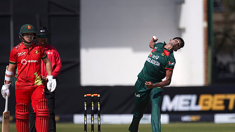 Bangladesh's bowler Nahid Rana (R) bowls as Zimbabwe's batsman Ben Curran watches on during the second ODI between Zimbabwe and Bangladesh, in Harare, Zimbabwe on Thursday