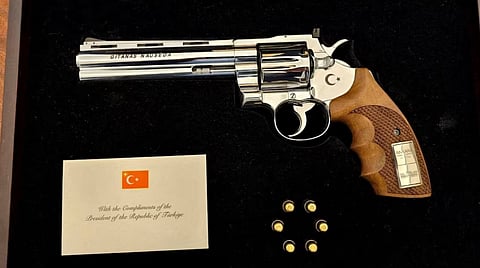 After NATO leaders gathered for Wednesday's fractious summit in Ankara, their host, Turkish President Recep Tayyip Erdogan, handed each an unusual parting gift: a vintage revolver, along with live ammunition.