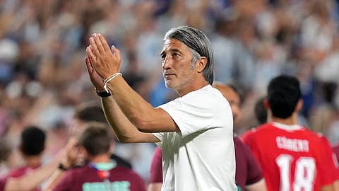 Switzerland coach Murat Yakin applauds fans after the quarterfinal match against Argentina