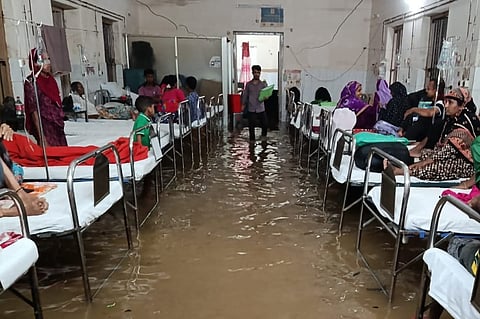 Floodwater inundates patient wards and cabins at Comilla General Hospital following heavy rainfall, disrupting healthcare services.