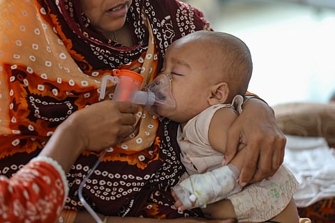 A child receives oxygen support while undergoing treatment for measles-related complications at DNCC Covid 19 hospital, Mohakhali.