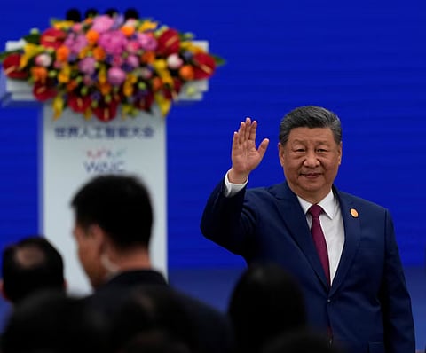 Chinese President Xi Jinping waves as he arrives at the opening ceremony for the World AI Conference in Shanghai, China, July 17, 2026