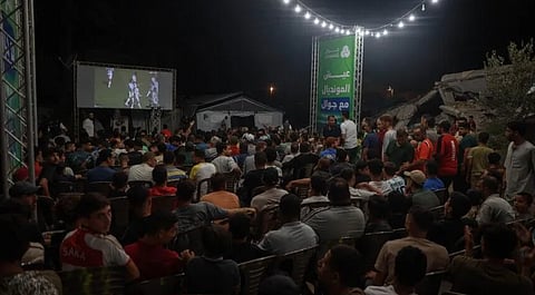 Residents of Gaza's Nuseirat refugee camp gather to watch the 2026 FIFA World Cup final, cheering as Spain defeat Argentina in a brief escape from the hardships of daily life.