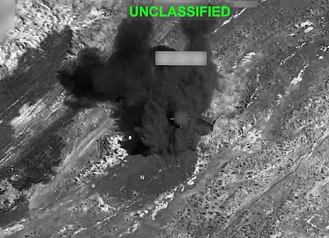 Smoke rises from an explosion at an unknown location, during what U.S. Central Command (CENTCOM) says are strikes on Iran, in this still image taken from a handout video released on 19 July 2026.