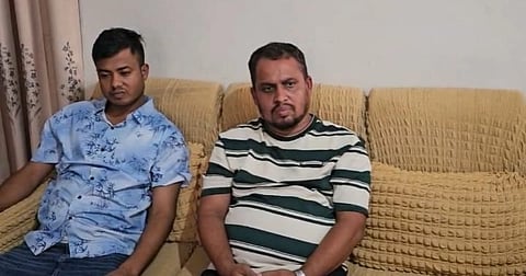 Two men, who posed as members of the Detective Branch (DB) in Savar after allegedly defrauding a woman of Tk 7 lakh, in custody of police on July 21, 2026.