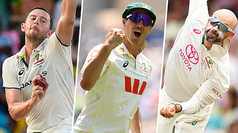Australia's Josh Hazlewood (L), Pat Cummins (C) and Nathan Lyon