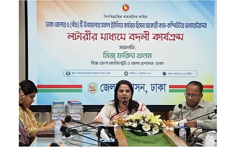 Dhaka Deputy Commissioner Farida Khanom conducts the lottery-based posting process for Union Parishad secretaries at the Deputy Commissioner's Office in Dhaka on Wednesday.