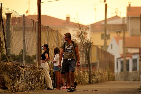 People watch the wildfire of Navaluenga, Avila, Spain July 23, 2026.