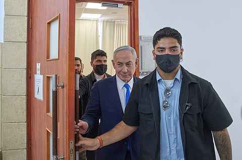 Israeli Prime Minister Benjamin Netanyahu leaves the courtroom after his hearing on corruption charges at the district court in east Jerusalem, Wednesday, July 15, 2026.