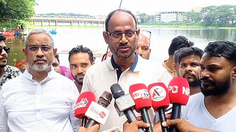State Minister for Fisheries and Livestock Sultan Salauddin Tuku speaks to reporters after inaugurating a cleanup drive at DC Lake in Tangail on Friday.