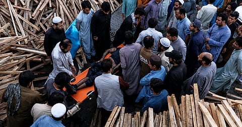 People transport the body of a miner recovered after an explosion inside a coal mine on the outskirts of Quetta, in southwest Pakistan, Thursday, July 30, 2026.
