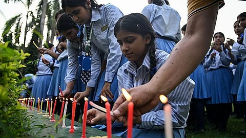 Students and staff at Purja's former school lit candles in commemoration of him.