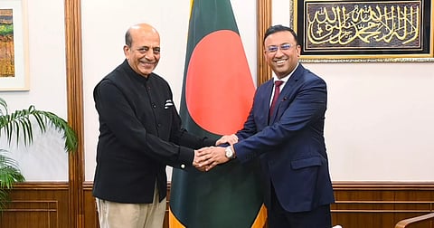 Prime Minister's Foreign Affairs Adviser Humayun Kabir shakes hands with newly appointed Indian High Commissioner to Bangladesh Dinesh Trivedi during a meeting at the Prime Minister's Office in Tejgaon on Monday.