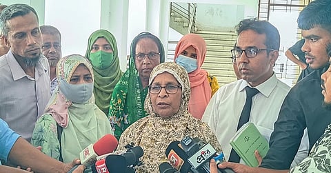 The mother of slain journalist Utshya Rahman speaks to journalists outside a Rangpur court after the verdict in his 2015 murder case on Wednesday.