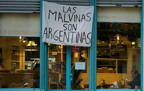 A poster supporting Argentina’s claim to the disputed Falkland Islands hangs in Buenos Aires on Tuesday.
