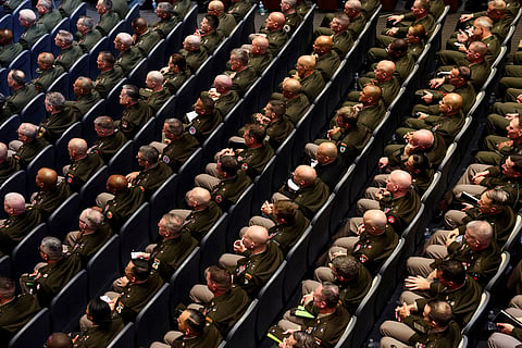Members of the military attend a meeting convened by US Defense Secretary Pete Hegseth, at Marine Corps Base Quantico, in Quantico, Virginia, US, September 30, 2025.