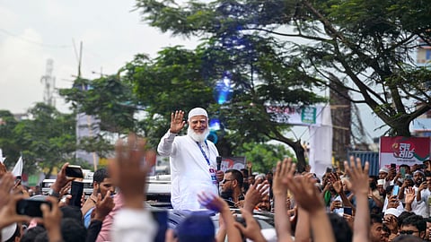 Dr Shafiqur Rahman greets people during the long march.