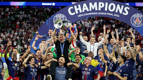 Paris Saint-Germain coach Luis Enrique celebrates with players and staff after their UEFA Champions League final victory over Arsenal in Budapest, Hungary.