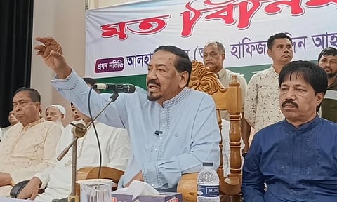 Jatiya Sangsad Speaker Hafiz Uddin Ahmad speaking at a view-exchange meeting
in Lalmohan.