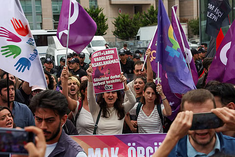 People gather outside Caglayan Courthouse, known as the Justice Palace, in solidarity with the LGBTQ+ community and to protest a government campaign that has included sweeping raids on LGBTQ+ associations, in Istanbul, Turkey, September 15, 2026.