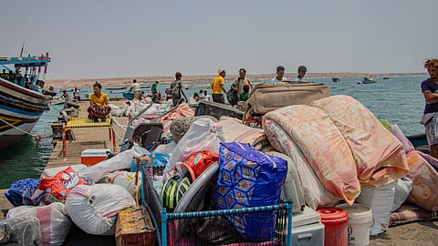 People fleeing from clashes between Houthi fighters and Saudi-backed Yemeni government forces, dock with their belongings at the shores of Obock on the Northern shore of the Gulf of Tadjoura, opening out into the Gulf of Aden in Djibouti, September 14, 2026.