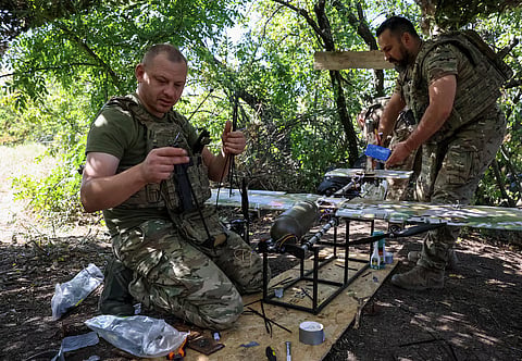 Ukrainian servicemen from the special police Brigade Hyzhak (Predator) prepare to launch a Blyskavka (Lightning), strike drone, towards Russian troops from a position near a front line, amid Russia's attack on Ukraine, near the frontline in Donetsk region, Ukraine September 10, 2026