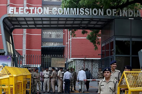 Members of security forces stand guard at the entrance of Election Commission of India headquarters on the day of a protest by the supporters of India’s main opposition Congress party demanding the resignation of Chief Election Commissioner Gyanesh Kumar, in New Delhi, India, September 25, 2026.