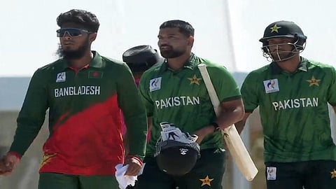 Pakistan's Abdul Samad (C) and Hasan Nawaz (R) walk back after winning the Asian Games 2026 semifinal against Bangladesh in Nagoya, Japan on Thursday.