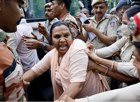 Police officers detain protesters during a protest demanding the resignation of India's Chief Election Commissioner Gyanesh Kumar, in New Delhi, India, October 2, 2026.