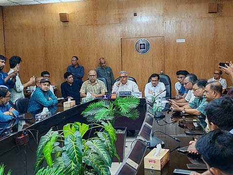 Rajshahi University Vice-Chancellor Professor Faridul Islam speaks to protesting students and journalists after an attack on journalists on the campus.