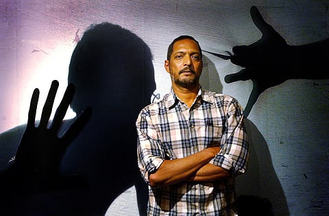 Bollywood star Nana Patekar, who plays the role of a policeman, poses for photographers during a media gathering to speak about his role in the Indian movie "Ab Tak Chhappan" (56 Until Now), in Bombay March 3, 2004