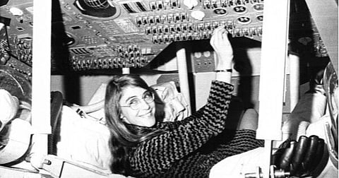 Margaret Hamilton, of Cambridge, Mass., mathematic and computer programmer at the MIT Instrumentation Laboratory, sits in mock up of Apollo command module on display at the Cambridge school, Nov. 25, 1969, where she headed group that programmed Intrepid's pinpoint landing in the Sea of Storms on the moon