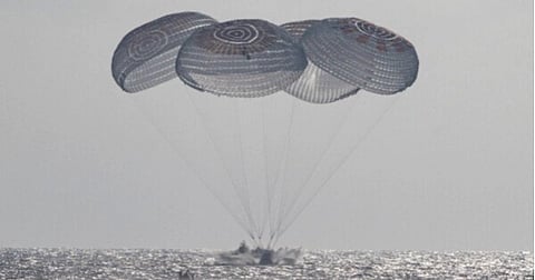 In this photo provided by NASA, the SpaceX Crew Dragon Freedom spacecraft splashes down in the Pacific Ocean off the coast of California on Thursday, Oct. 8, 2026, returning from the International Space Station