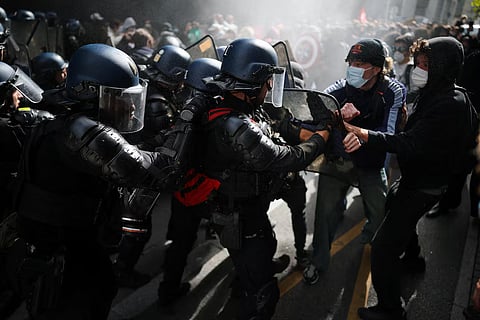 Protesters clash with French gendarmes, as French high school and university students attend a demonstration in Nantes as part of a nationwide day of protests and blockades to demand better school conditions in France, October 8, 2026