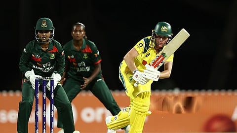 Australia’s Beth Mooney bats as Bangladesh captain Nigar Sultana Joty watches on during the first ODI at Allan Border Field in Brisbane, Australia.