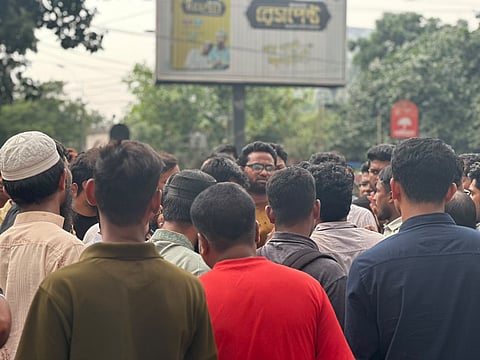 The decision triggered protests at examination centers before candidates moved onto major roads, blocking Manik Mia Avenue and Satmasjid Road.