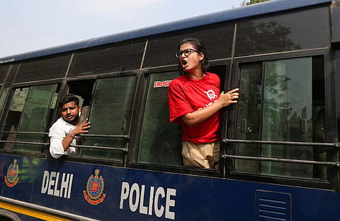 Neha Bora, National President of the All India Students' Association (AISA), shouts from a police vehicle after being detained during a protest organised by the Cockroach Janta Party (CJP) seeking the resignation of India's Chief Election Commissioner, Gyanesh Kumar, in New Delhi, India, October 10, 2026.