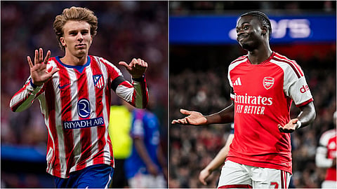 Atletico Madrid's Pablo Barrios (L) and Arsenal's Bukayo Saka celebrate after scoring for their teams.