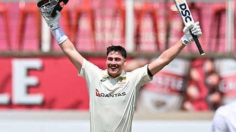 Australia batter Matt Renshaw celebrates after scoring a century against South Africa in the first Test.