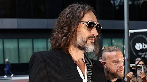 British actor and comedian Russell Brand arrives at Southwark Crown Court where he stands trial on charges of rape and sexual assault involving six women between 1999 and 2009, which he denies, in London, Britain, October 14, 2026.