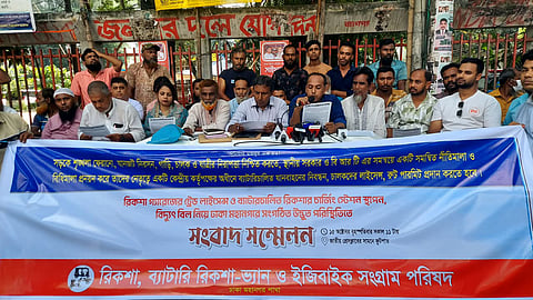 Leaders of the Rickshaw, Battery Rickshaw-Van and Easy Bike Struggle Council address a press conference outside the National Press Club in Dhaka on Thursday