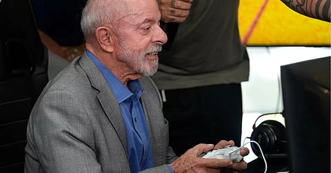 Brazilian President Luiz Inacio Lula da Silva, who is running for reelection, plays a Brazilian video game before a ceremony to sign a decree regulating the video game industry in Brasilia, Brazil, Wednesday, Oct 14, 2026.