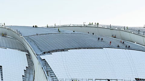 Workers carry out construction work at Aramco Stadium, one of the main stadiums set to host the 2027 AFC Asian Cup, in Khobar, Saudi Arabia, July 9, 2026.